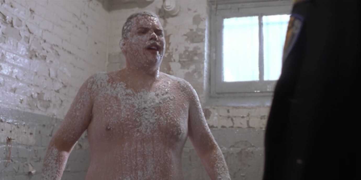 Farva from Super Troopers being “deloused” with powdered sugar.